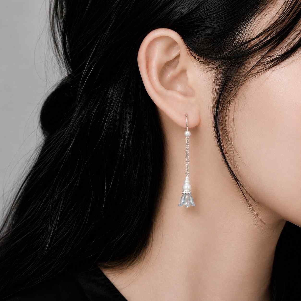 elegant floral dangle earrings worn on ear
